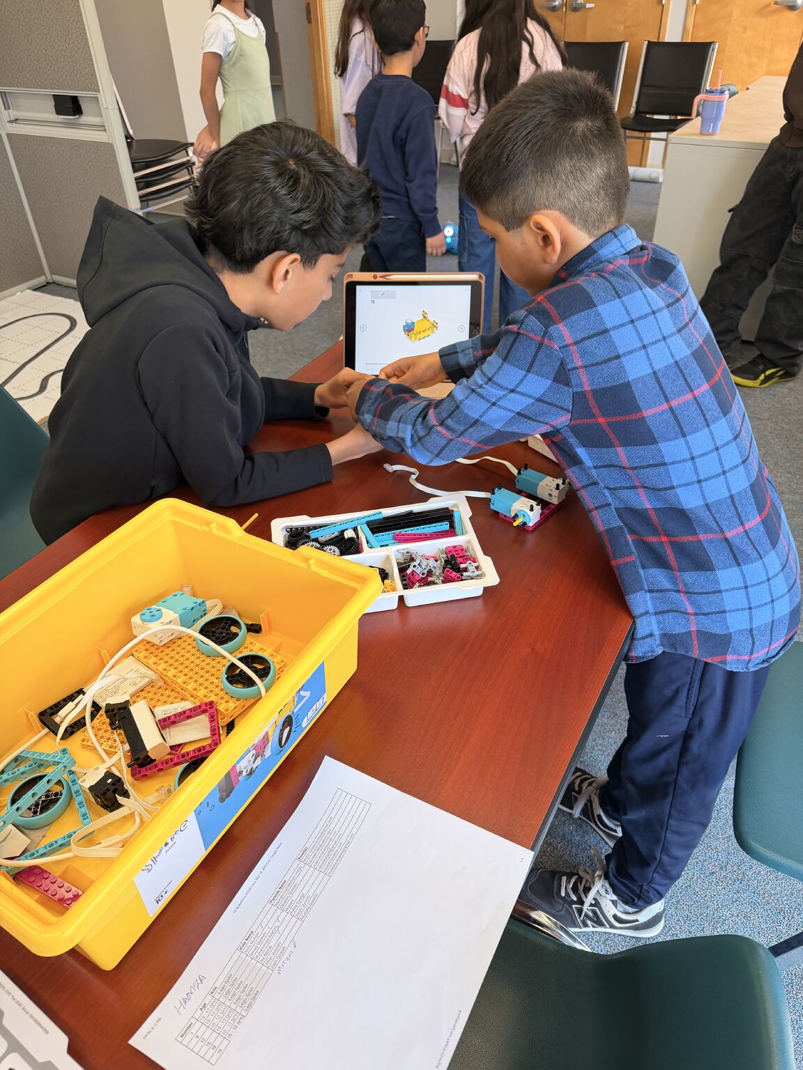 Youth exploring robotics and STEM activities at the NOBLE Institute program in Delta, BC