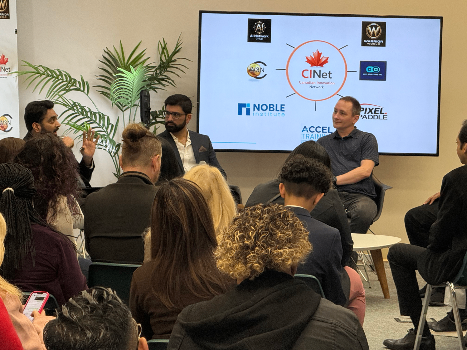 Panel discussion in front of the Canadian Innovation Network partner slide