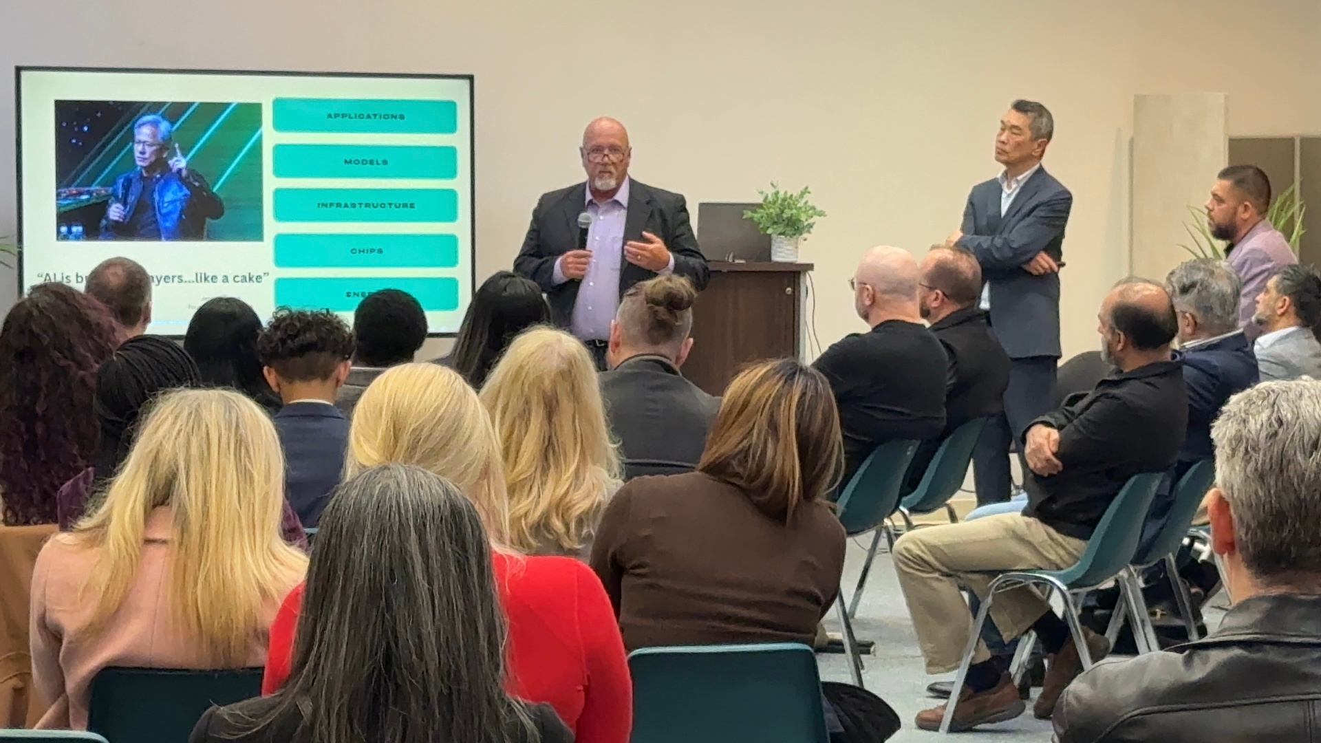 Keynote speaker addressing attendees on AI and productivity